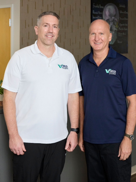 Two dentists at Vista Dental Group smiling for a photo.